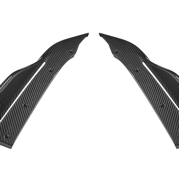 Two elongated, symmetrical carbon fiber components with curved edges and drilled holes are positioned facing each other against a plain, white background.