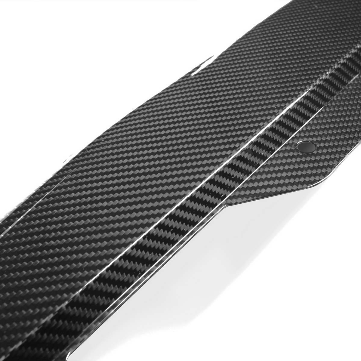A sleek carbon fiber car component with a checkered pattern features bolt holes for attachment, set against a plain white background.
