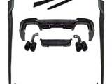 Various black car body kit components, such as spoilers and exhaust tips, are arranged neatly on a white background, showcasing automotive parts for potential assembly or installation.