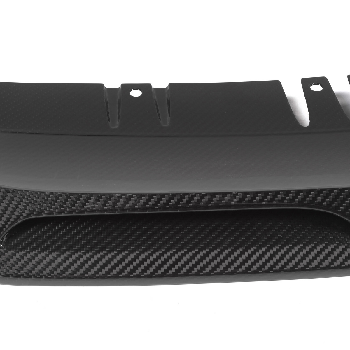 A carbon fiber car diffuser with a sleek, aerodynamic design features curved fins and vent openings, set against a plain white background.