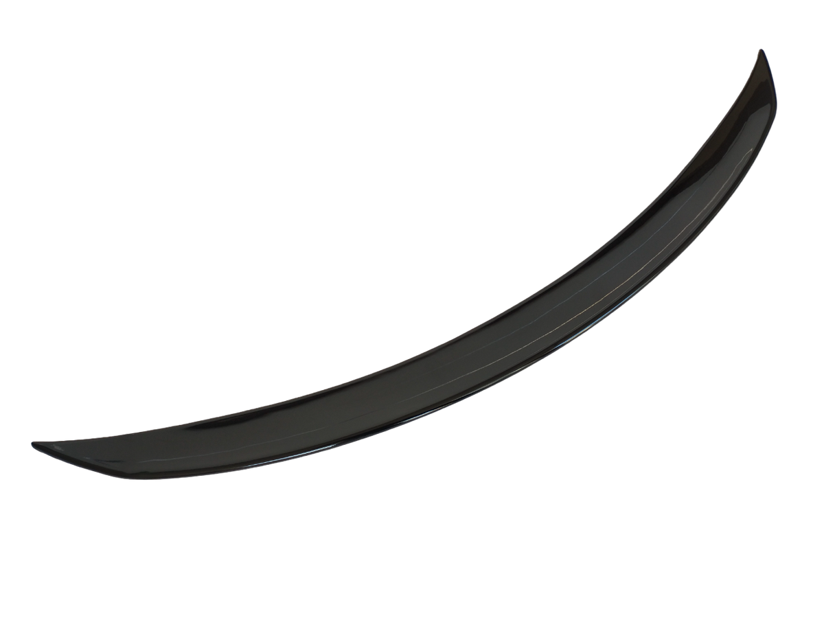 A curved, glossy black car spoiler is isolated on a white background, showcasing its aerodynamic design.
