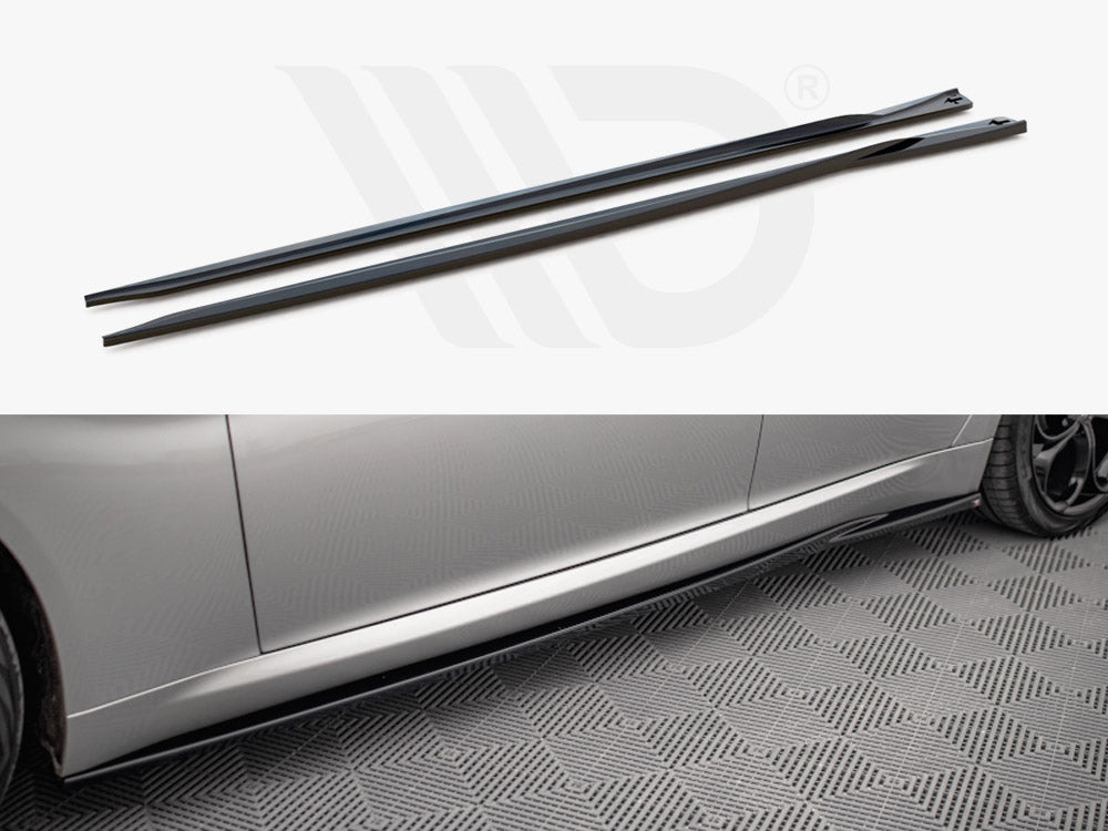 Two black side skirts lie parallel; below is a silver car with one skirt installed, resting on a textured gray floor.
