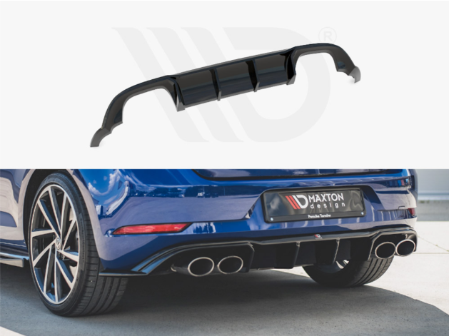 A black car diffuser, enhancing aerodynamics, is displayed above a blue car's rear with four exhaust pipes. The car's license plate reads "MAXTON DESIGN, Przedsiębiorstwo Tuningu."