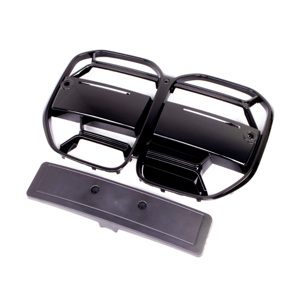 Black plastic vent covers with multiple horizontal slats are positioned on a white background. They appear detached and are accompanied by a long, rectangular panel below.