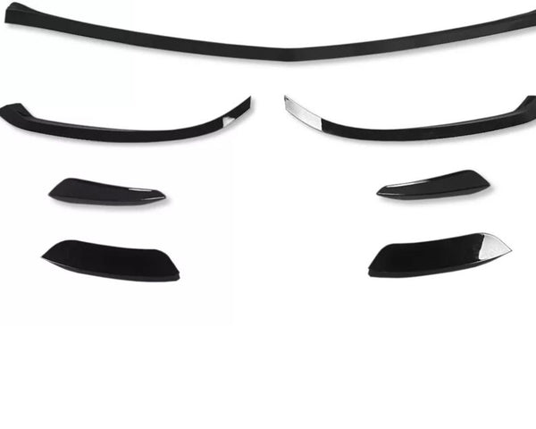 Black car spoiler kit pieces arranged on a plain white background, displaying various sizes and curved shapes, suggesting different mounting options for customization.