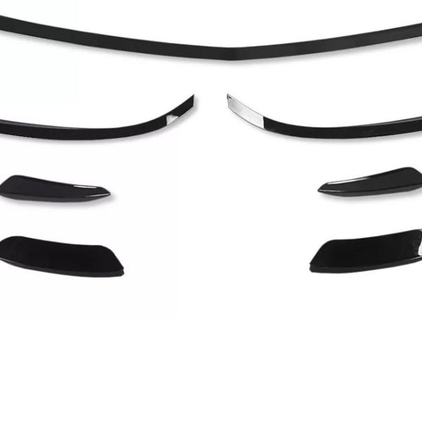 Black car spoiler kit pieces arranged on a plain white background, displaying various sizes and curved shapes, suggesting different mounting options for customization.