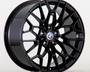 A black, multi-spoke alloy wheel with a BMW logo at the center is displayed against a plain white background.