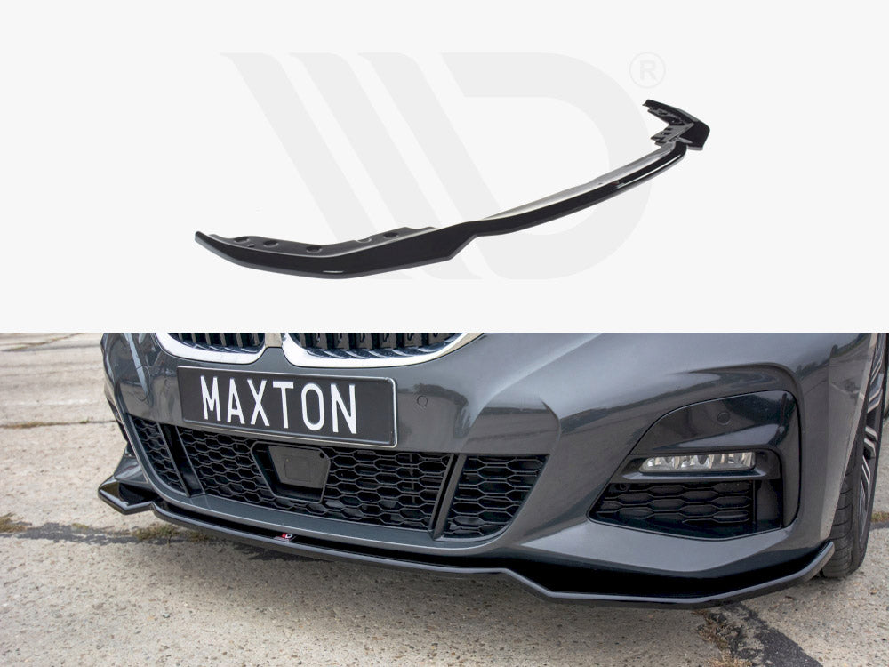 A black car front lip spoiler is shown above its installation on a gray car with a "MAXTON" plate, set on a concrete surface.