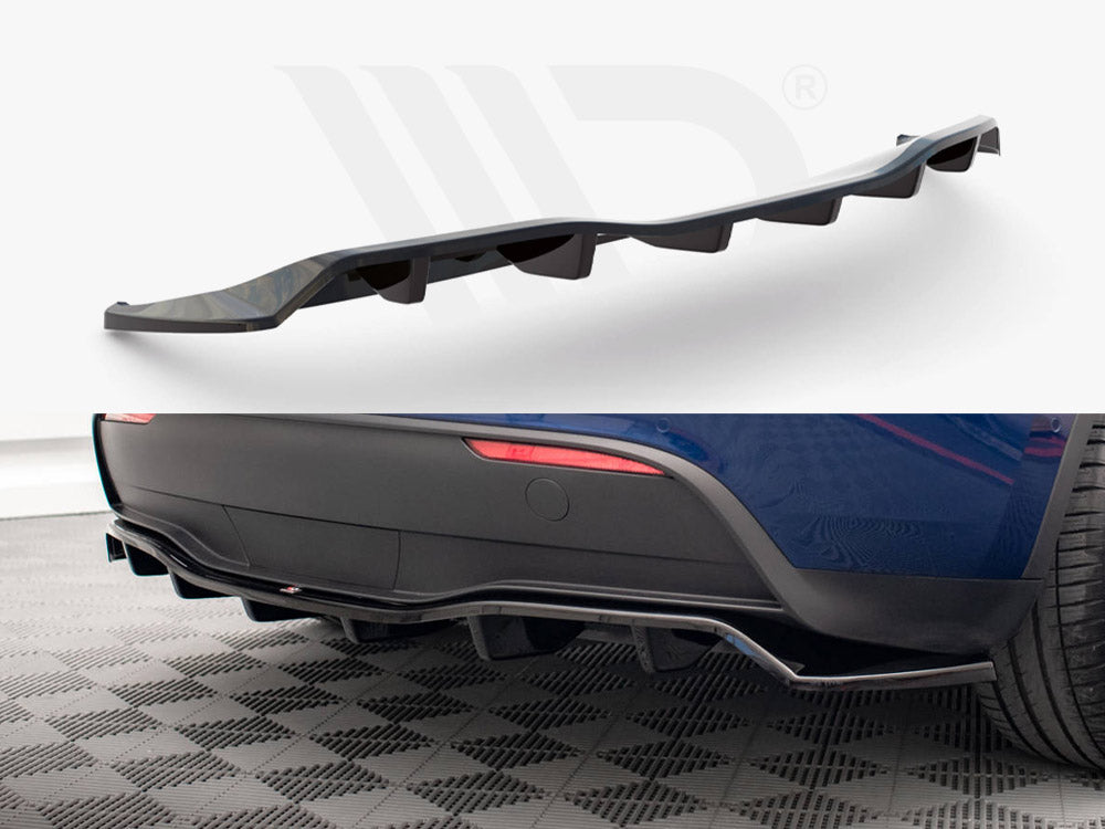 Curved black car diffuser, with angled fins, is displayed against a white backdrop and attached under the rear of a blue car, highlighting its sporty aesthetic on a checkered floor.