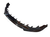 A black car bumper lip spoiler featuring multiple fins is resting against a white background, designed for aerodynamic enhancement.