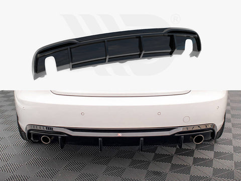 A black car rear diffuser lies above the image of a white car's rear bumper featuring dual exhaust pipes and a checkered floor beneath.