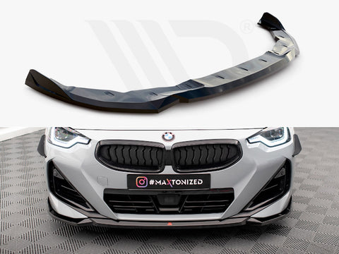 A black car front splitter sits positioned for attachment. Below, a gray BMW car features an installed splitter on a checkered floor. The text reads "#MAXTONIZED."
