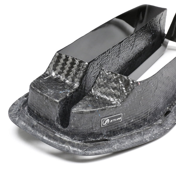 A carbon-fiber shell with a textured surface features a "Stilo" logo, set against a plain white background, showcasing the glossy and intricate material finish.