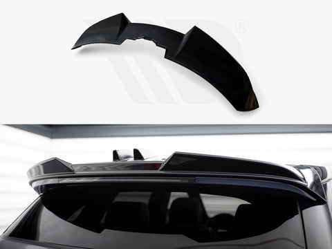 A black car spoiler is shown detached above and installed on a vehicle's roof. The sleek design complements the car's rear window in a garage-like setting.