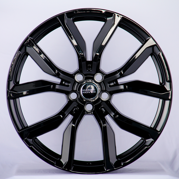 A glossy black alloy wheel with a five-double-spoke design, featuring the "Range Rover" logo at the center, displayed against a plain white background.