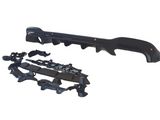 A shiny black automotive bumper with aerodynamic features is positioned on a white background, accompanied by various mounting brackets and components arranged below it.