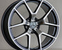 A Mercedes-Benz alloy wheel stands upright, featuring a five-spoke design with a polished finish. The AMG logo is inscribed at the top. It's set against a neutral background.