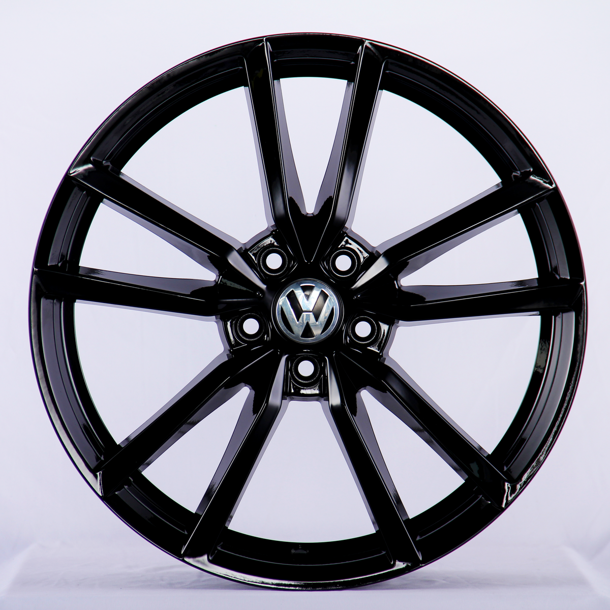 A glossy black car wheel rim with a Volkswagen logo at the center, featuring a split-spoke design, displayed against a plain white background.