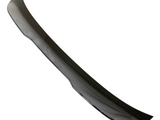 A sleek, black car spoiler, smoothly curved and glossy, is isolated against a plain white background, emphasizing its aerodynamic design.
