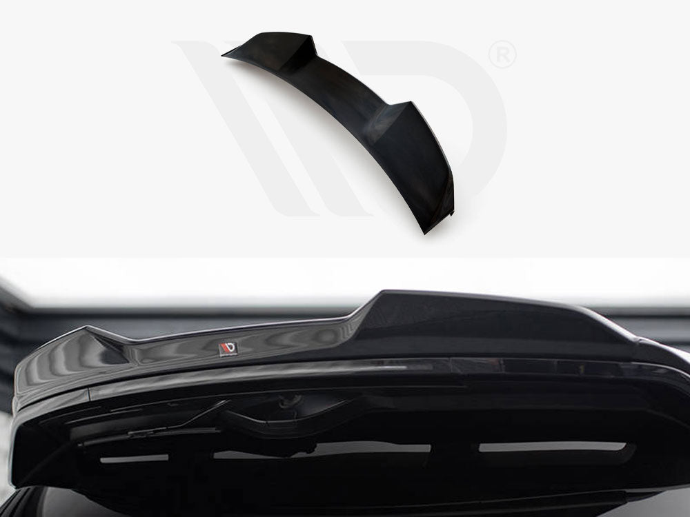 A black car spoiler, designed for aerodynamics, is positioned against a white background with branding visible. Its sleek design complements the rear of a vehicle, enhancing performance aesthetics.
