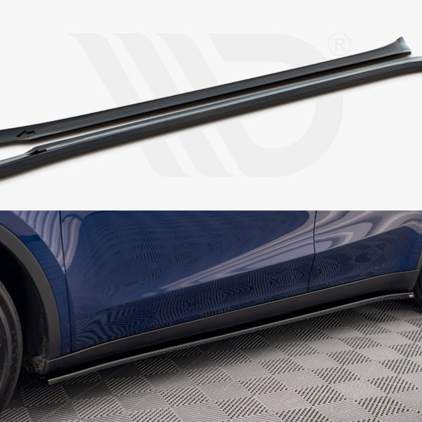 Two black side skirts are displayed above a blue car fitted with similar skirts, on a checkered floor. The setting emphasizes automotive accessories and installation.