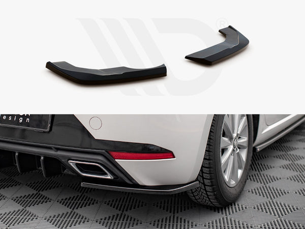 Two glossy, black plastic components are displayed. They are installation-ready extensions. Below, one is fitted to a white car's rear fender, sitting on a checkered floor mat.