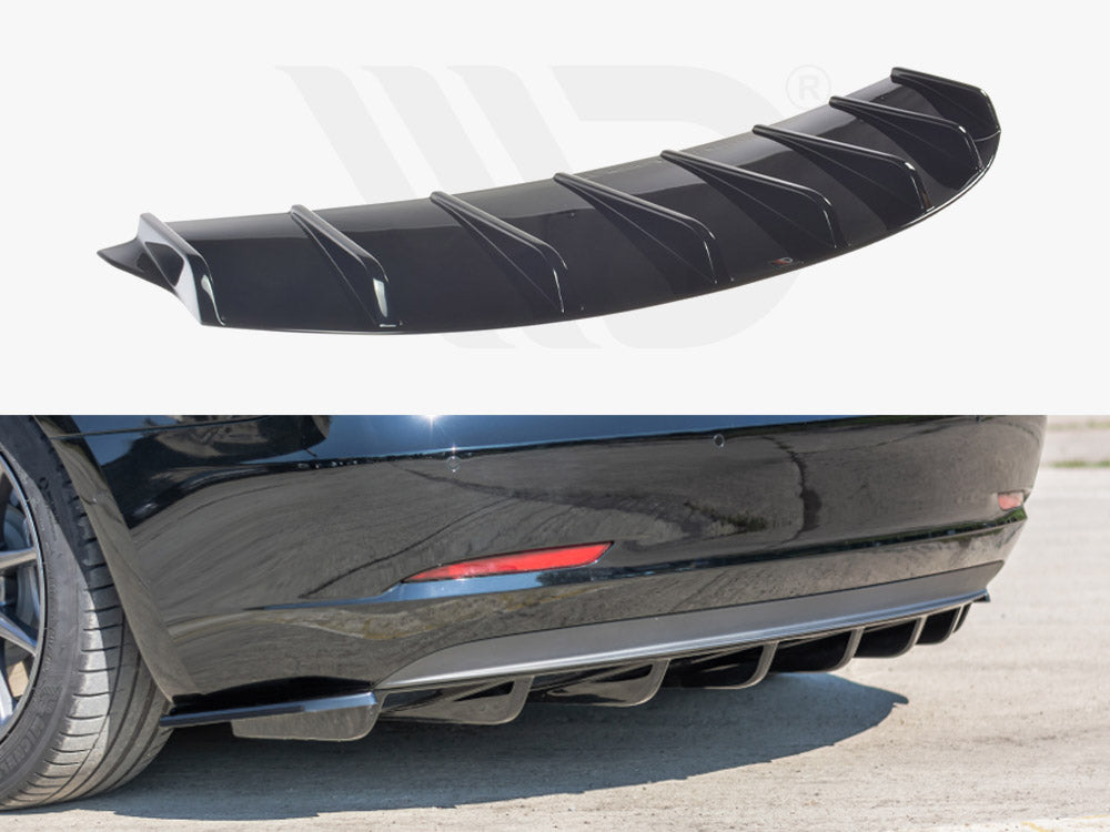 A black car diffuser with fin-like structures shown detached above, and attached below to the rear bumper of a black car parked on a concrete surface. No text present.
