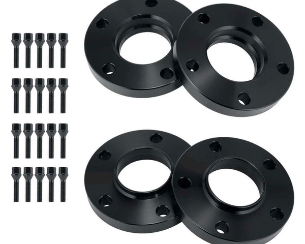 Four black circular metal spacers with central and peripheral holes are paired with 16 matching bolts, arranged in an orderly fashion on a plain white background.