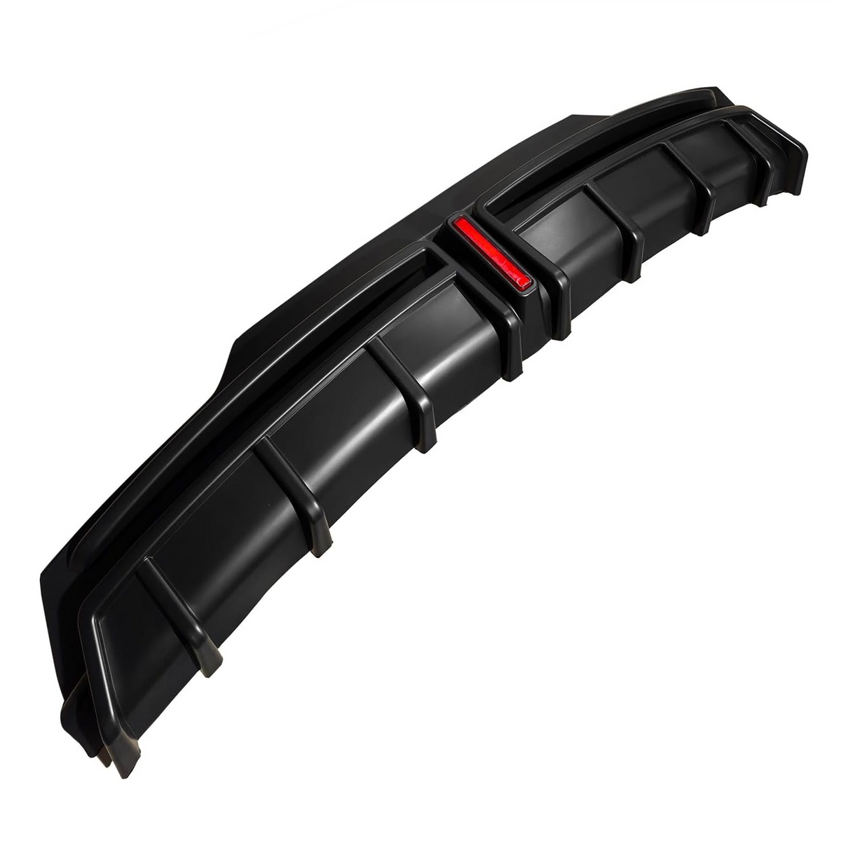 A black car rear diffuser, featuring several vertical fins, is positioned on a white background. It includes a small central red reflector strip, designed for aerodynamic enhancement.