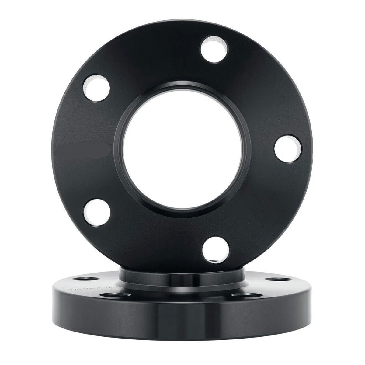 A black circular metal flange with five bolt holes is vertically positioned, placed on another similar flange beneath it against a plain white background.