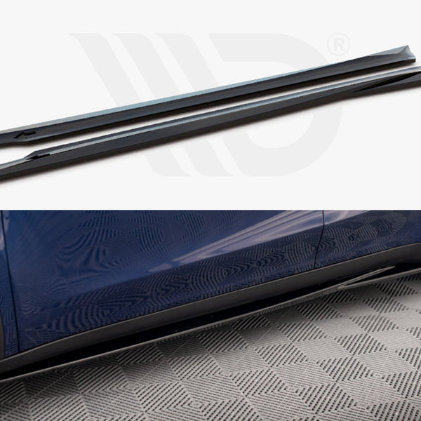 Two aerodynamic side skirts are shown, designed to be installed on a car. They are black and sleek, depicted both separately and attached to a blue car standing on a checkered floor.