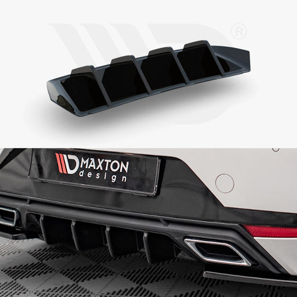 A black car diffuser with fins is shown. It's attached to the rear bumper of a white vehicle. The context includes a garage floor and "MAXTON design" text on the car.
