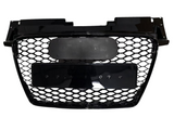 A black honeycomb car grille, featuring two mounting plates, is centrally positioned against a plain white background, displaying no additional text or surrounding elements.