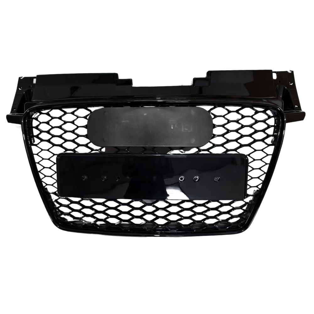A black honeycomb car grille, featuring two mounting plates, is centrally positioned against a plain white background, displaying no additional text or surrounding elements.