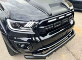 A black truck features prominently, showcasing its front grille with large letters spelling "FORD," and LED headlights, parked on a paved surface.