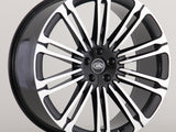 A multi-spoke alloy wheel with a black and silver finish, featuring the 