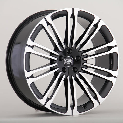 A multi-spoke alloy wheel with a black and silver finish, featuring the "Land Rover" logo at the center, is displayed against a plain background.