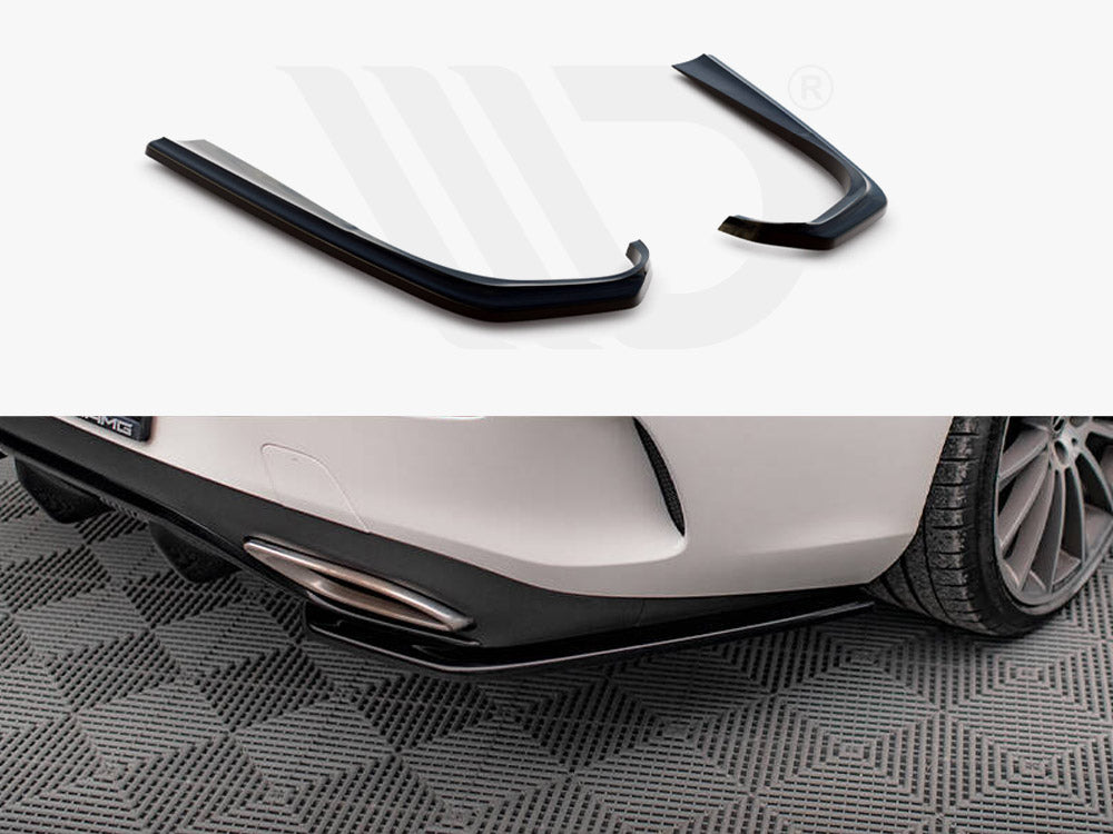 Black car accessories are displayed above; below, they are attached to a white car's rear bumper, parked on a patterned gray floor. The bottom edge of a license plate reads "AMG".