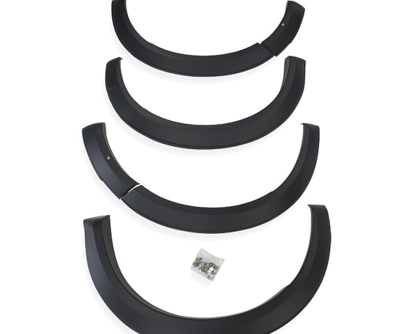 Four black plastic fender flares arranged vertically, each slightly curved, with a small bag of screws below, placed against a plain white background.