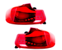 Two red car taillights are displayed side by side on a white background, showcasing their curved design and internal light bulb structure, indicating automotive components.