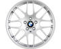 A silver alloy wheel with a BMW logo at the center, displaying multiple spokes, set against a plain white background.