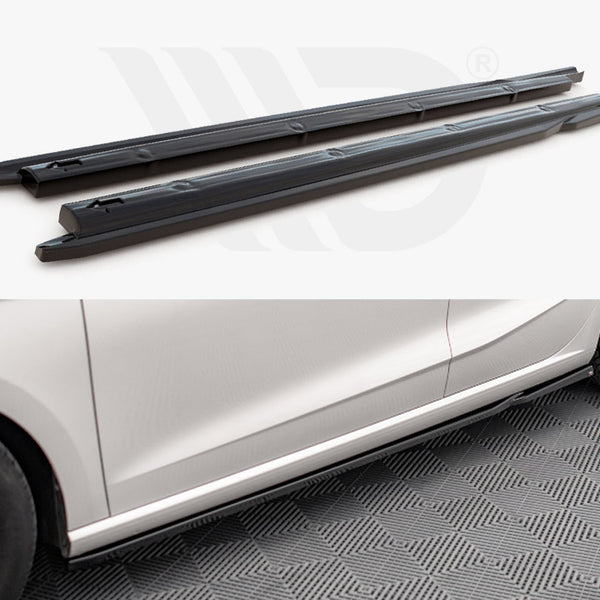 Two black side skirts are shown detached above, with the lower section displaying them installed on a white car parked on a patterned floor. No text is present.