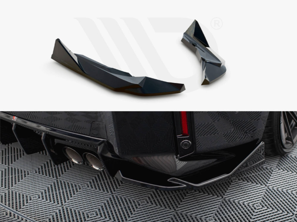 Two black car spoilers are shown. They are sleek and angular, designed for a vehicle's rear. The lower section depicts a car's rear bumper with a diffuser and dual exhaust pipes, set against a patterned floor.