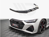 A black car front splitter is shown separately and installed on a gray Audi with black and red wheels, parked on a dark checkered floor. Text: 