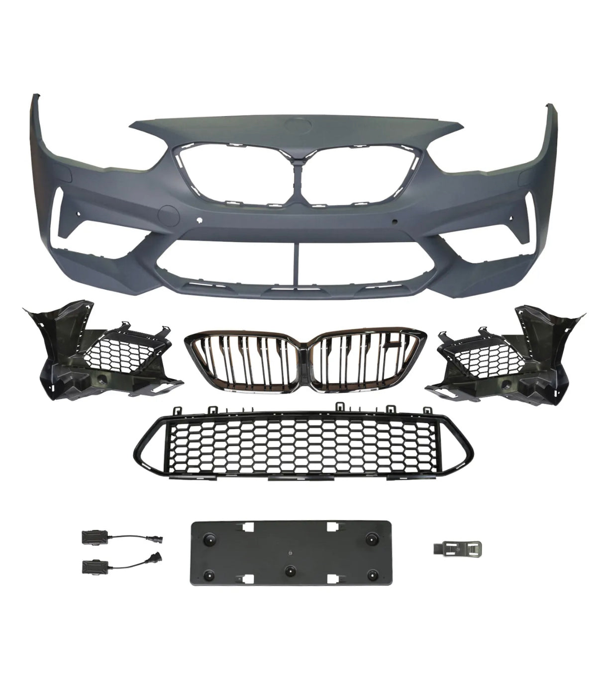 A collection of automotive parts includes a bumper cover, radiator grilles, and mounting brackets arranged on a plain background, suggesting components for vehicle front-end assembly.