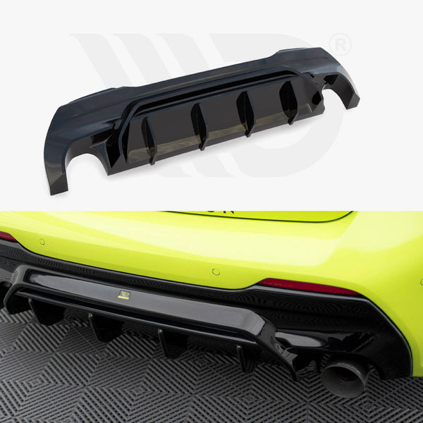 A black car diffuser is first shown separately, then attached under a bright yellow car's rear bumper, enhancing aerodynamics and aesthetics. The car is parked on a patterned surface.