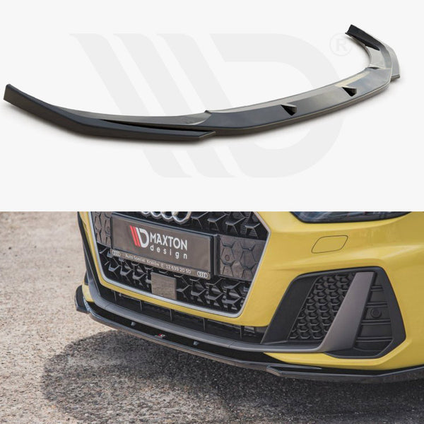 Black car front bumper lip is shown installed on a yellow vehicle parked on asphalt. The license plate reads “Maxton Design” with additional contact information.