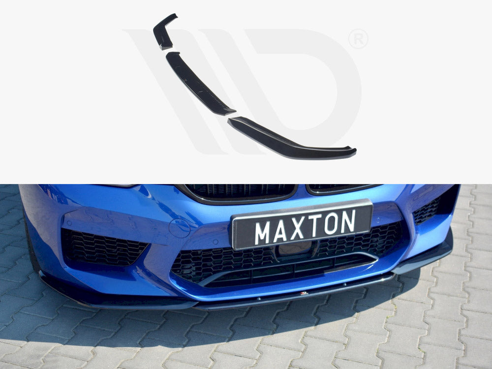 Car splitter attached to the front bumper of a blue vehicle parked on a gray cobblestone surface. Text on the license plate reads “MAXTON.”