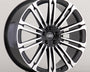 A black and silver Land Rover alloy wheel with multiple spokes is displayed against a plain gray background. The center cap features the "LAND ROVER" logo in white text.