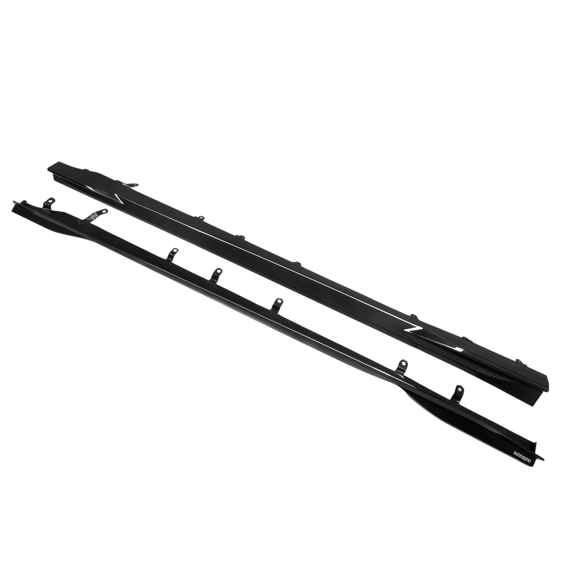 Two black side skirts with mounting brackets placed against a plain white background, each featuring a carbon fiber texture and the text "Z" and "SARD700."